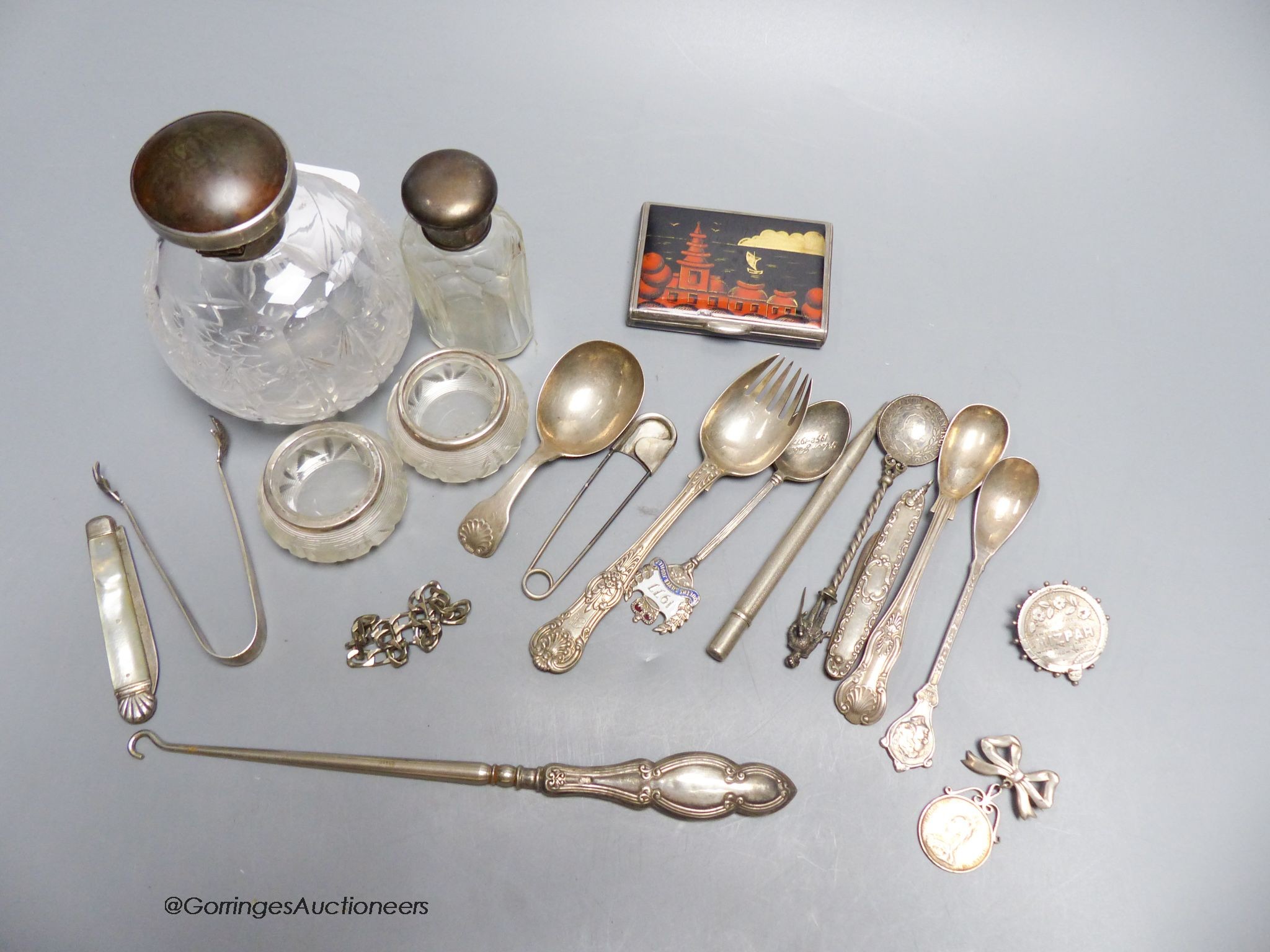 Two silver-mounted toilet bottles, a pair of silver-mounted salts, an enamelled silver box (a.f.), a caddy spoon, etc.